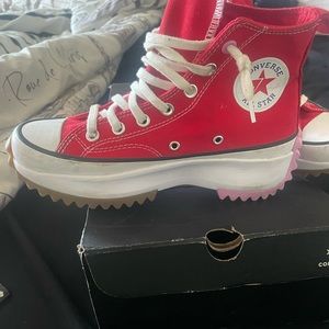 Red hightop platform Converse sneakers